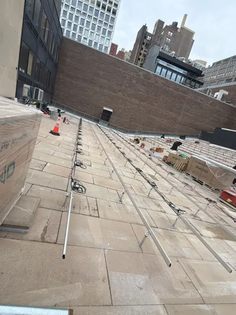 Commercial flat-roof racking between city buildings