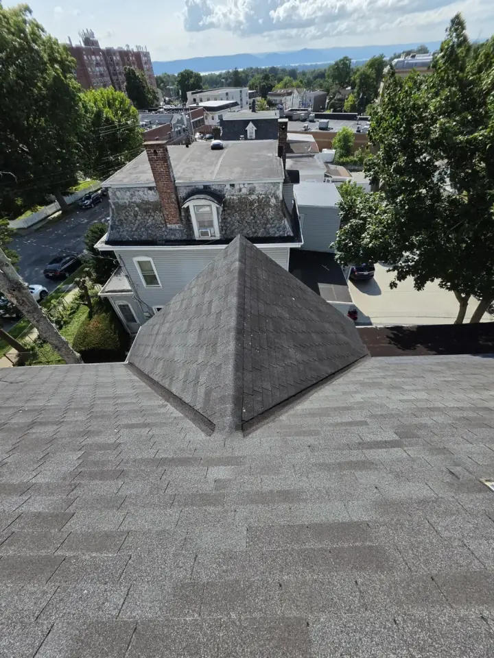 A roof peak, seen from the ridge during an inspection